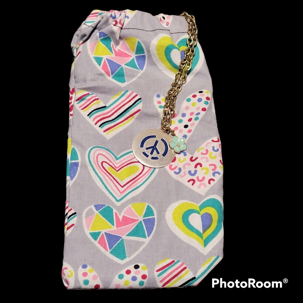 Handmade clutch bag with chain and charm accents